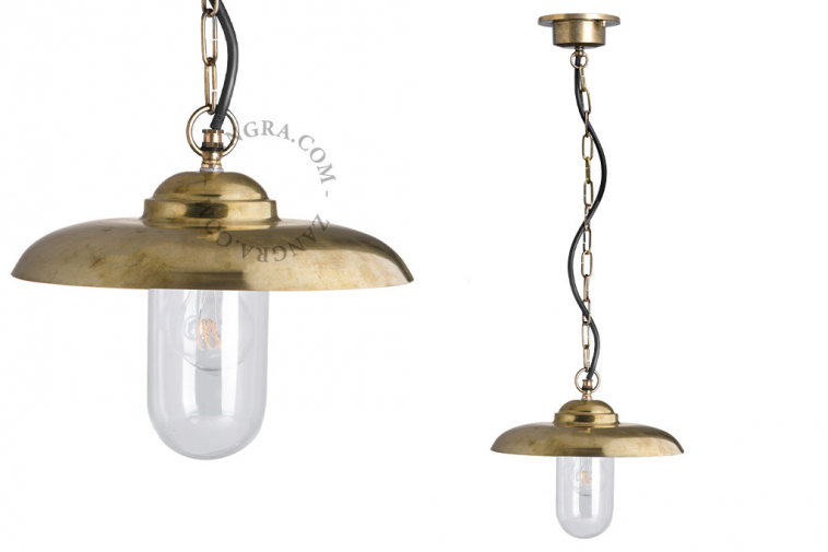 Raw brass pendant light for outdoor or bathroom use.