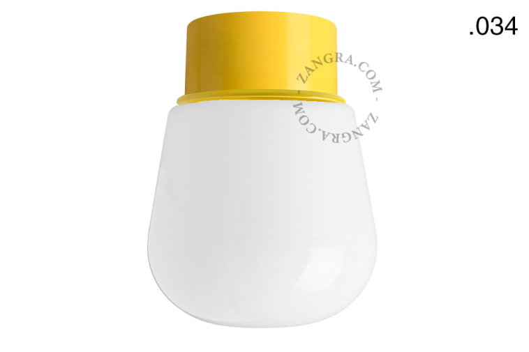 Yellow ceiling light with glass shade.