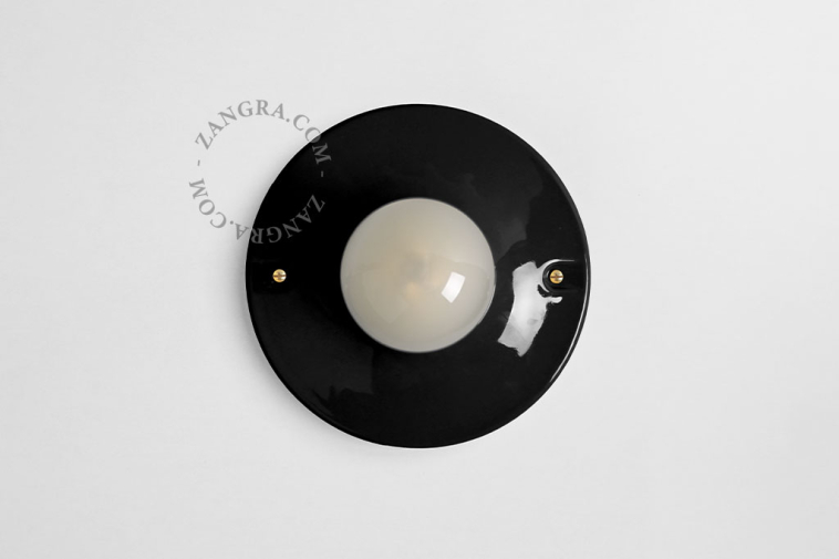 Black porcelain round light fixture.