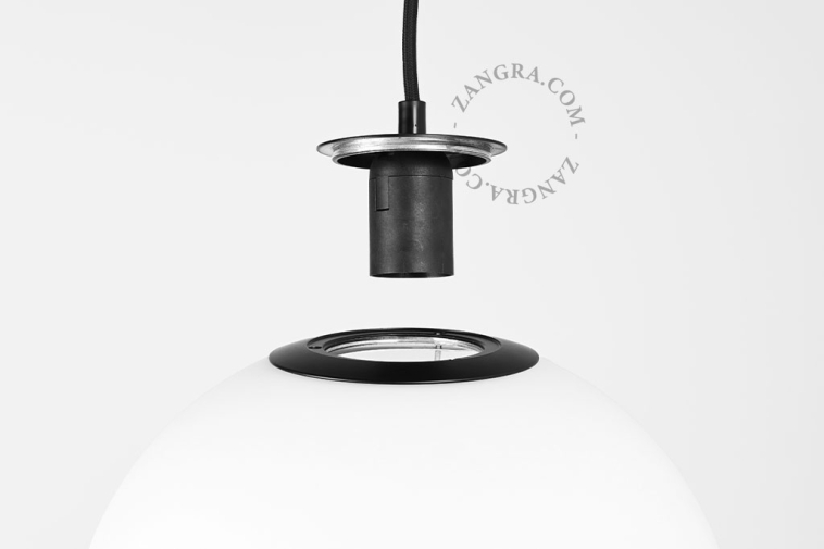 Pendant light with frosted glass lampshade.