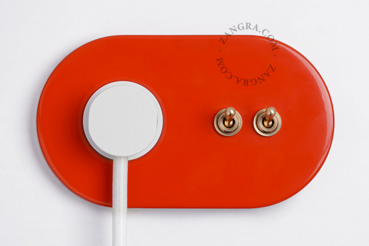red flush mount outlet & two-way or simple switch – double raw brass toggle