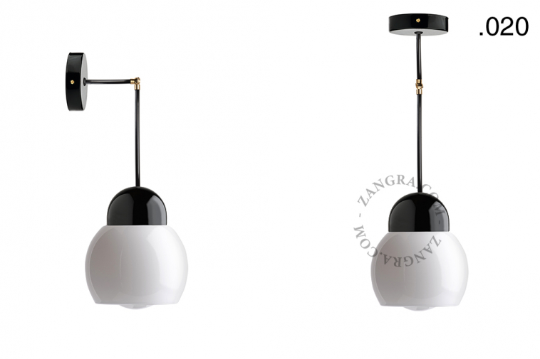 Black porcelain wall or ceiling light with glass shade.