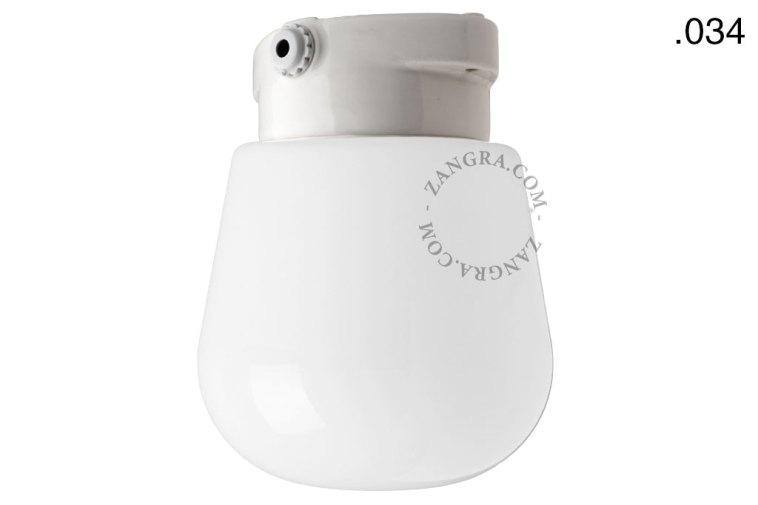 White porcelain light with glass globe for bathroom or outdoor use.
