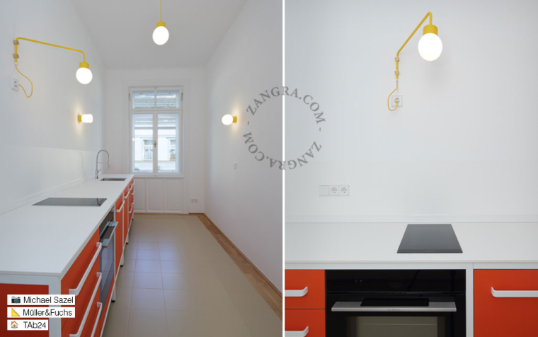 Yellow ceiling light with glass shade.