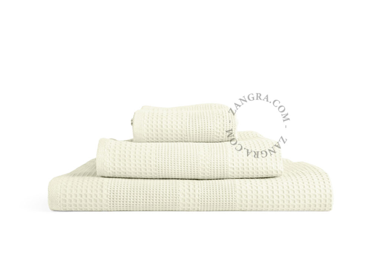 Beige honeycomb bath towel.