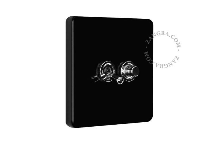 Black porcelain square-shaped switch.