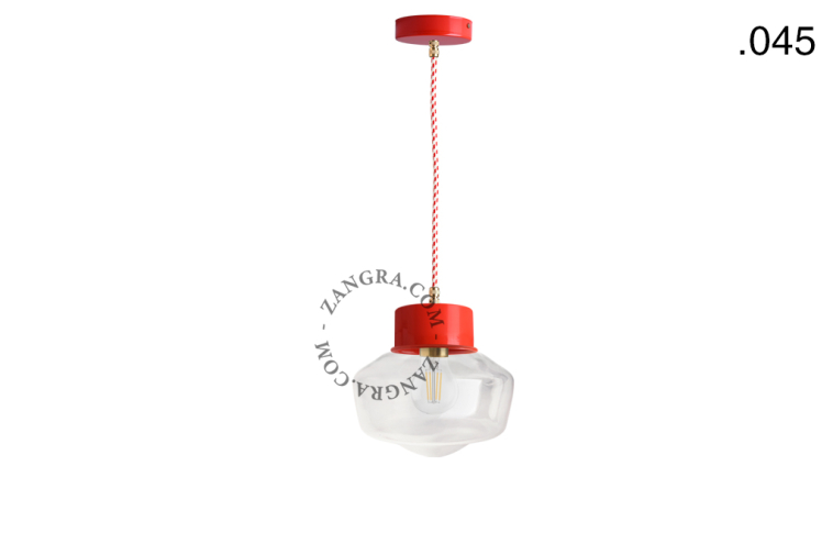 Red pendant light with glass shade.