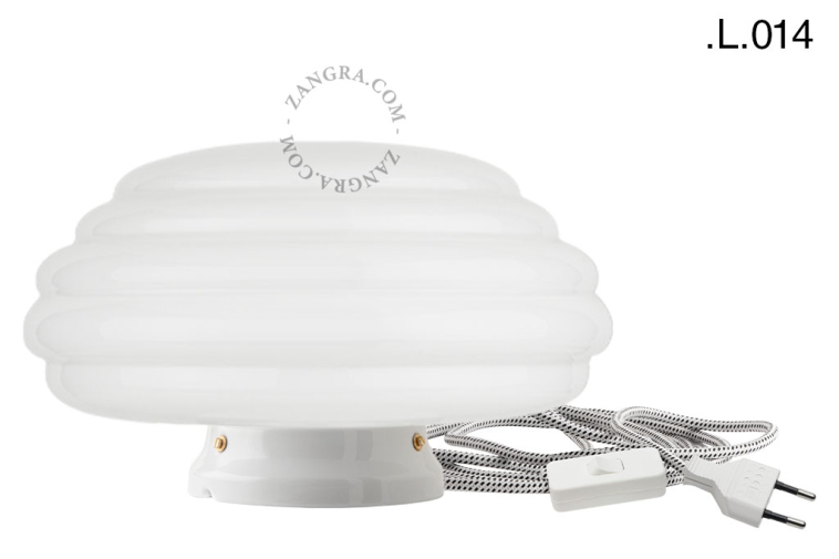 White porcelain table light with glass shade.
