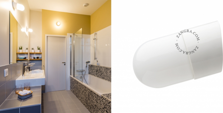 white porcelain wall light with glass globe for bathroom or outdoor use