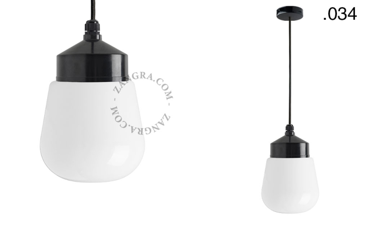 Black bakelite pendant light with glass shade.