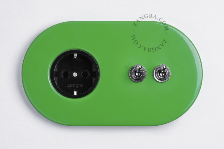 Green outlet & switch with toggle.
