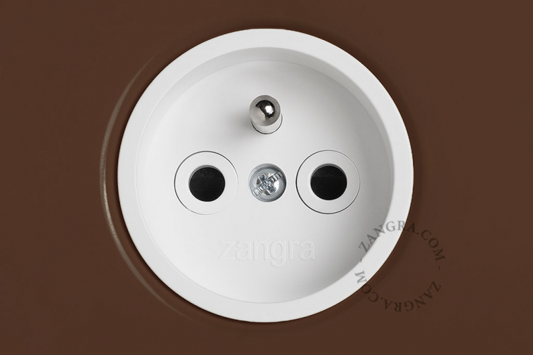 Brown outlet with double pushbutton.