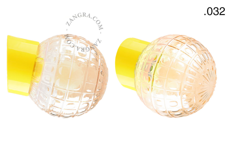 Yellow porcelain wall light with glass lampshade.