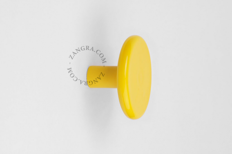 yellow porcelain coat hook or door knob