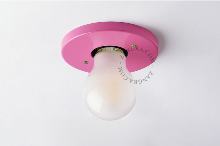 Pink flush mount spotlight.