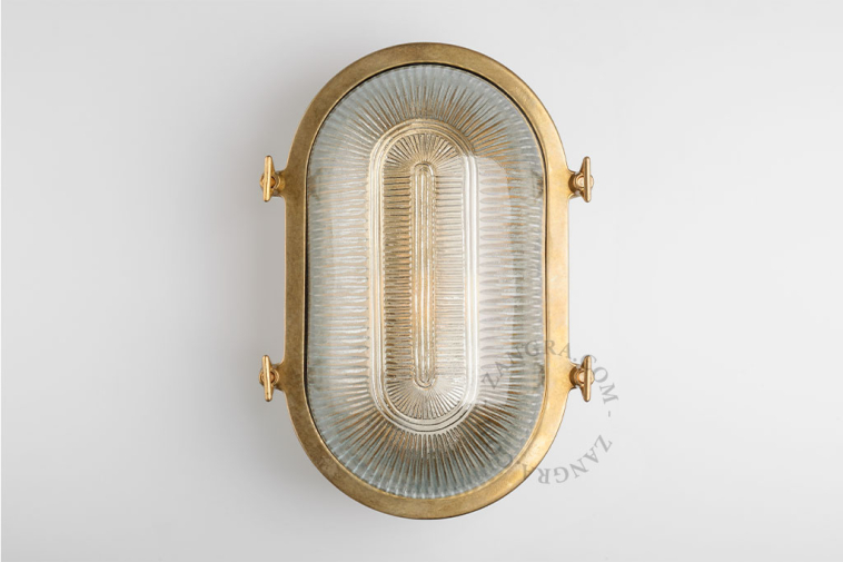 Brass bulkhead light with prismatic glass.