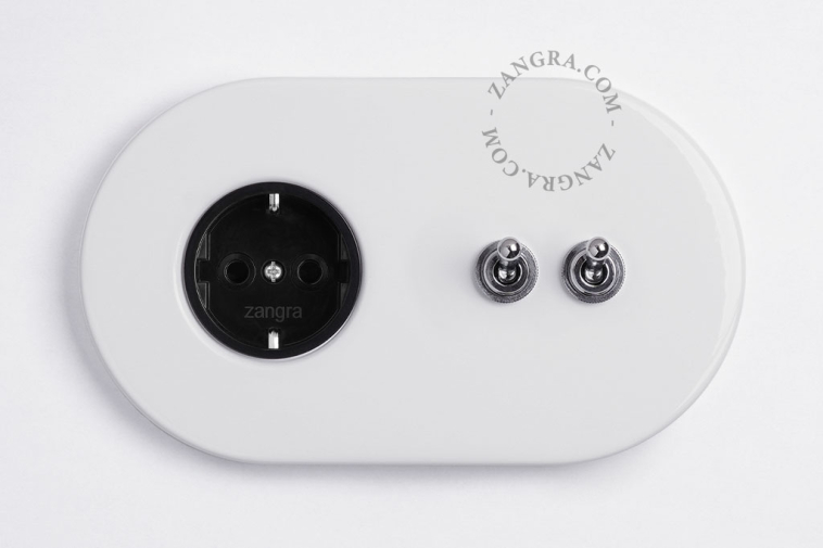 White flush mount outlet &  switch with 2 nickel-plated toggles.