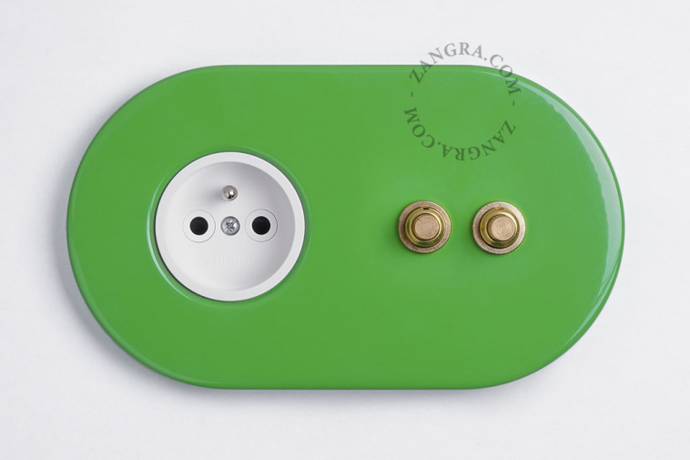 2 gold push buttons on green outlet.