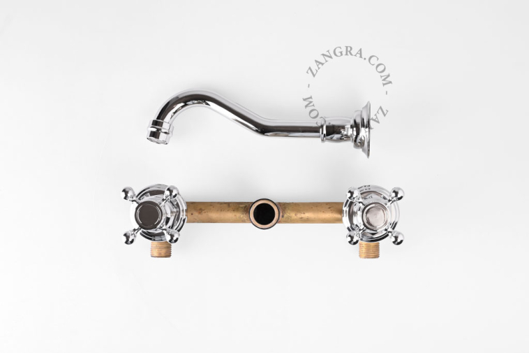 Concealed washbasin tap with two cross handles.