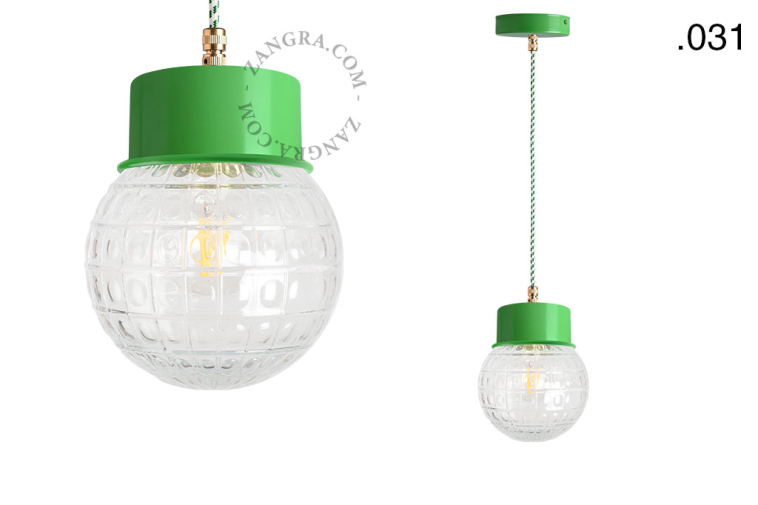 Green pendant light with glass shade.