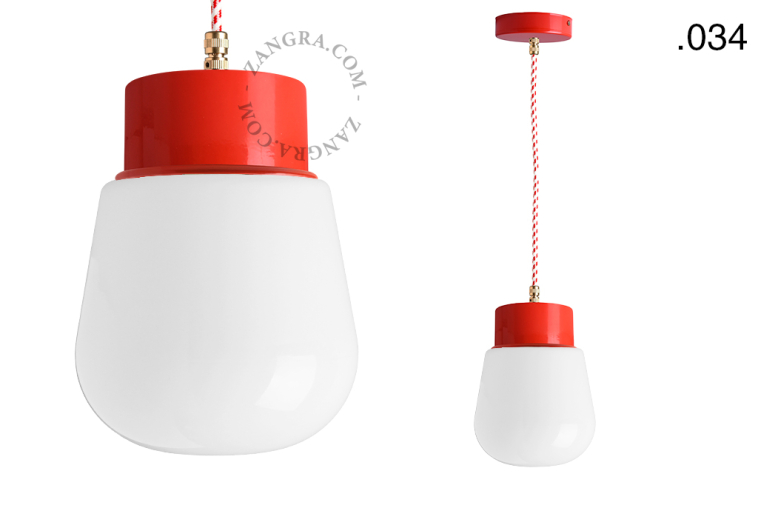 Red pendant light with glass shade.