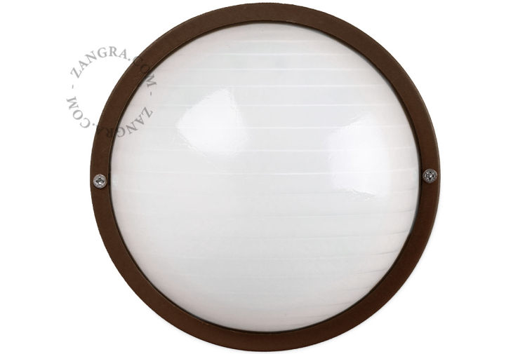 Round, brown bulkhead light.