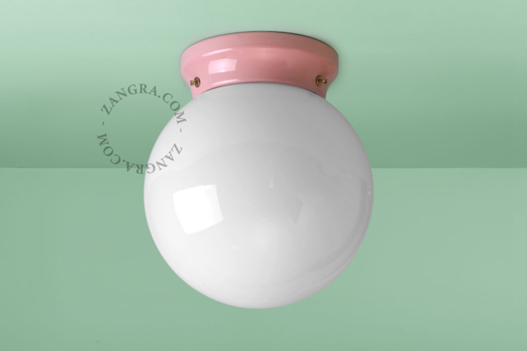 Pink porcelain Art Deco light with glass shade.