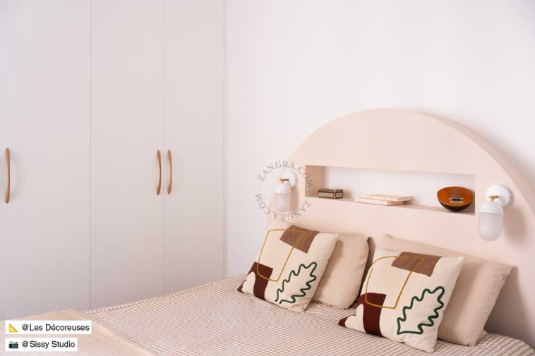 White porcelain adjustable wall light with glass shade.