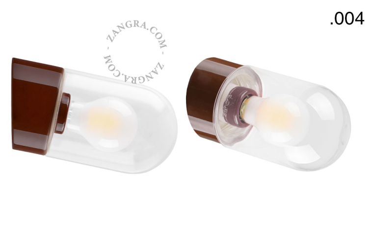 Brown porcelain wall light with glass lampshade.