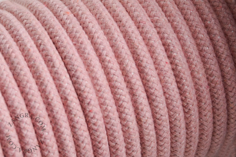 Electrical cable covered in pink cotton.