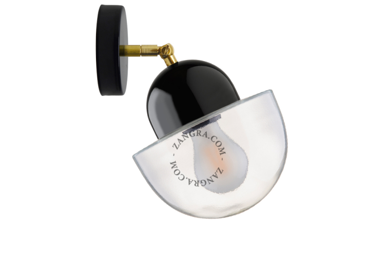 Black porcelain adjustable wall light with glass shade.