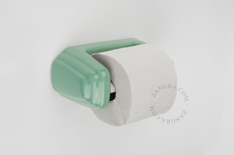 Green porcelain toilet paper holder.