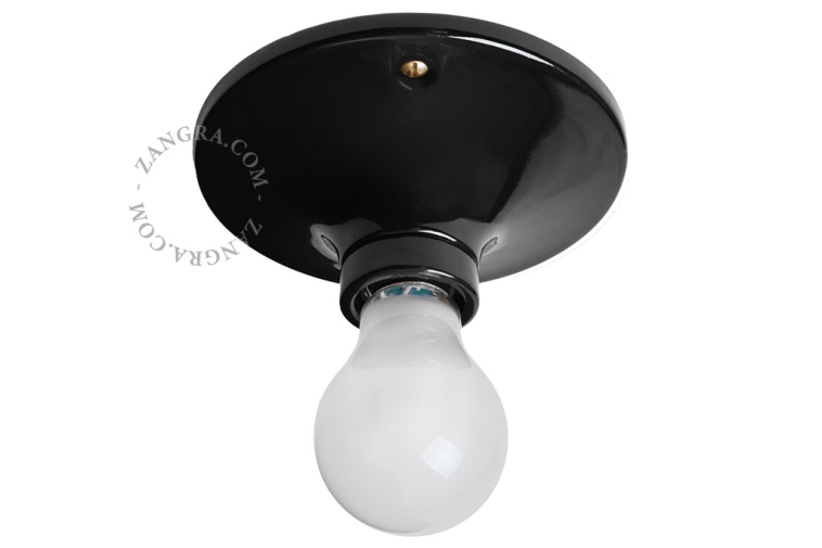 Lampe ronde en porcelaine noire.