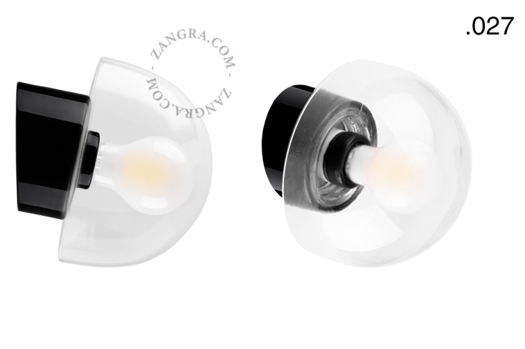 Black porcelain wall light with glass lampshade.