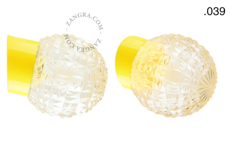 Yellow porcelain wall light with glass lampshade.