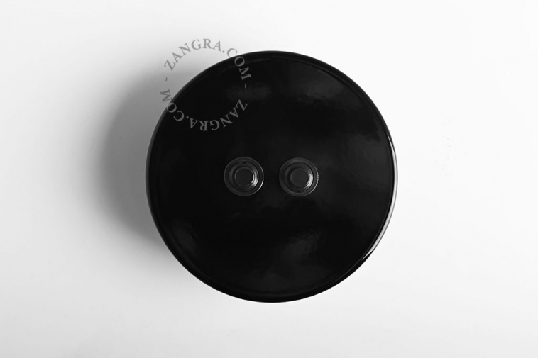 Round black double pushbuttons.