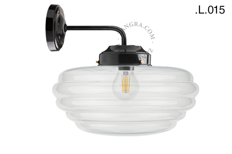 Black retro wall light schoolhouse style with glass shade.