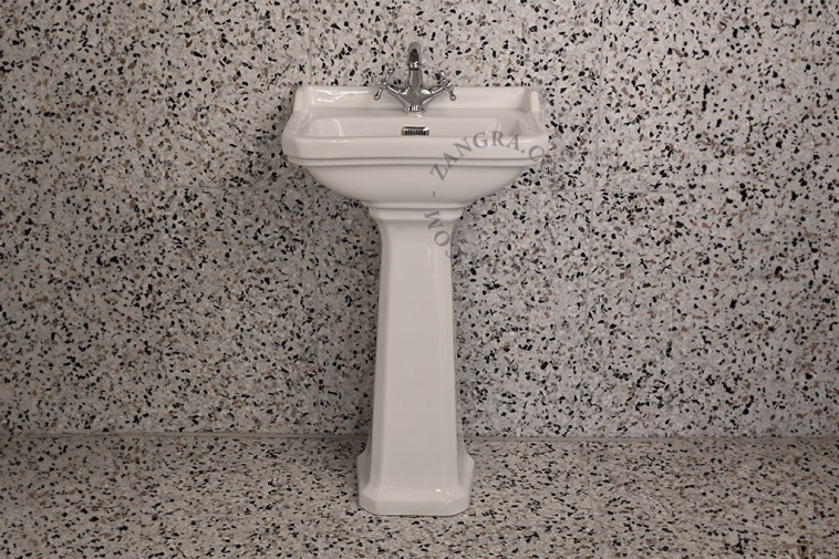 Art Deco washbasin on pedestal.