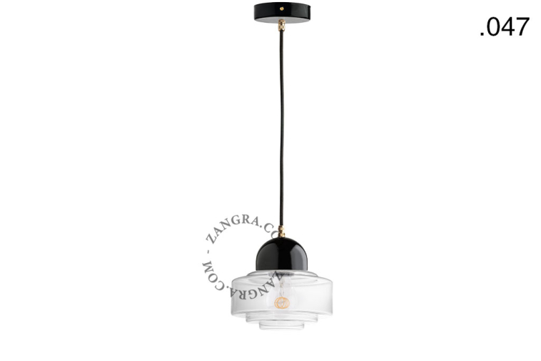 Black porcelain pendant light with glass shade.