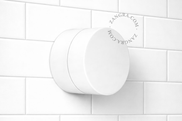 White porcelain light for bathroom or outdoor use.