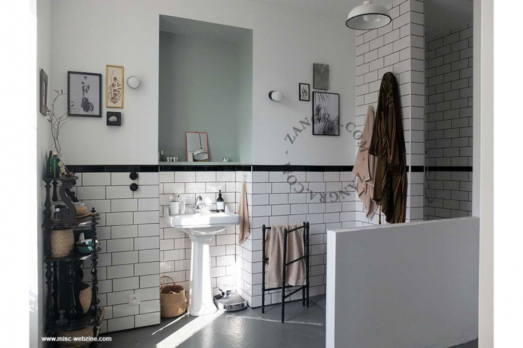 black porcelain wall light with glass shade