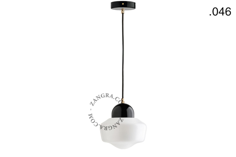 Black porcelain pendant light with glass shade.