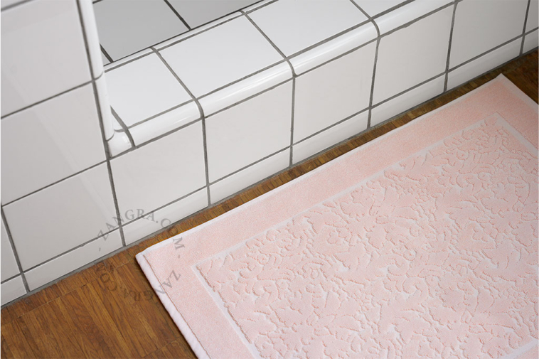 Pink cotton bath mat.