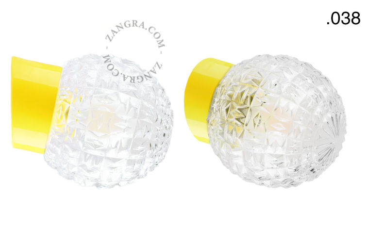 Yellow porcelain wall light with glass lampshade.
