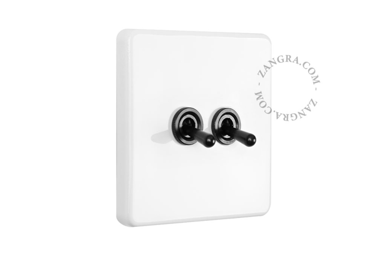 White porcelain square-shaped switch.