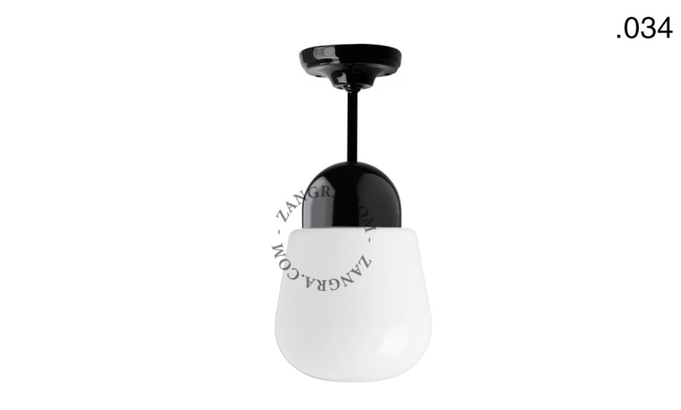 Black porcelain ceiling light with glass shade.
