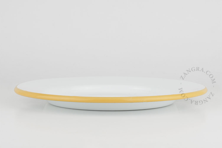 White enamel plate with caramel yellow rim.