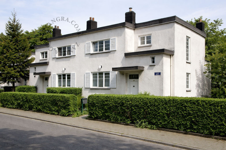 Round light fixture in black porcelain and glass.