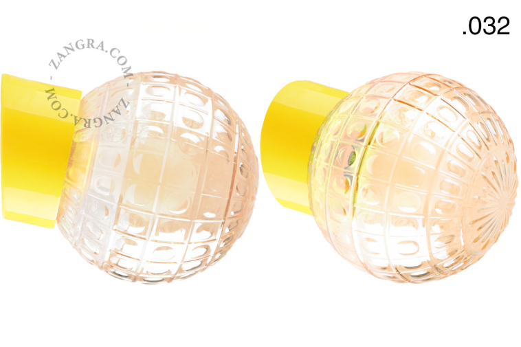 Yellow porcelain wall light with glass lampshade.