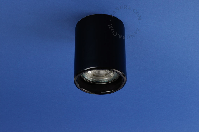 Black porcelain surface mounted spotlight.